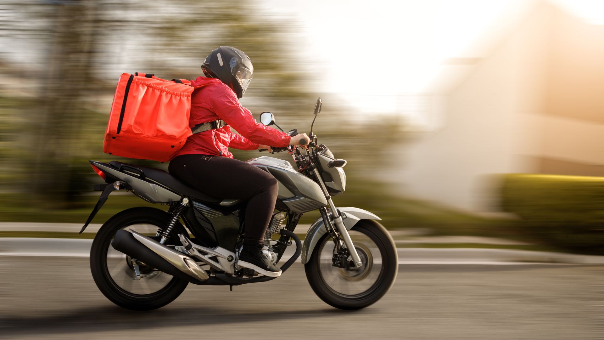 A delivery driver speeds along on an electric bike