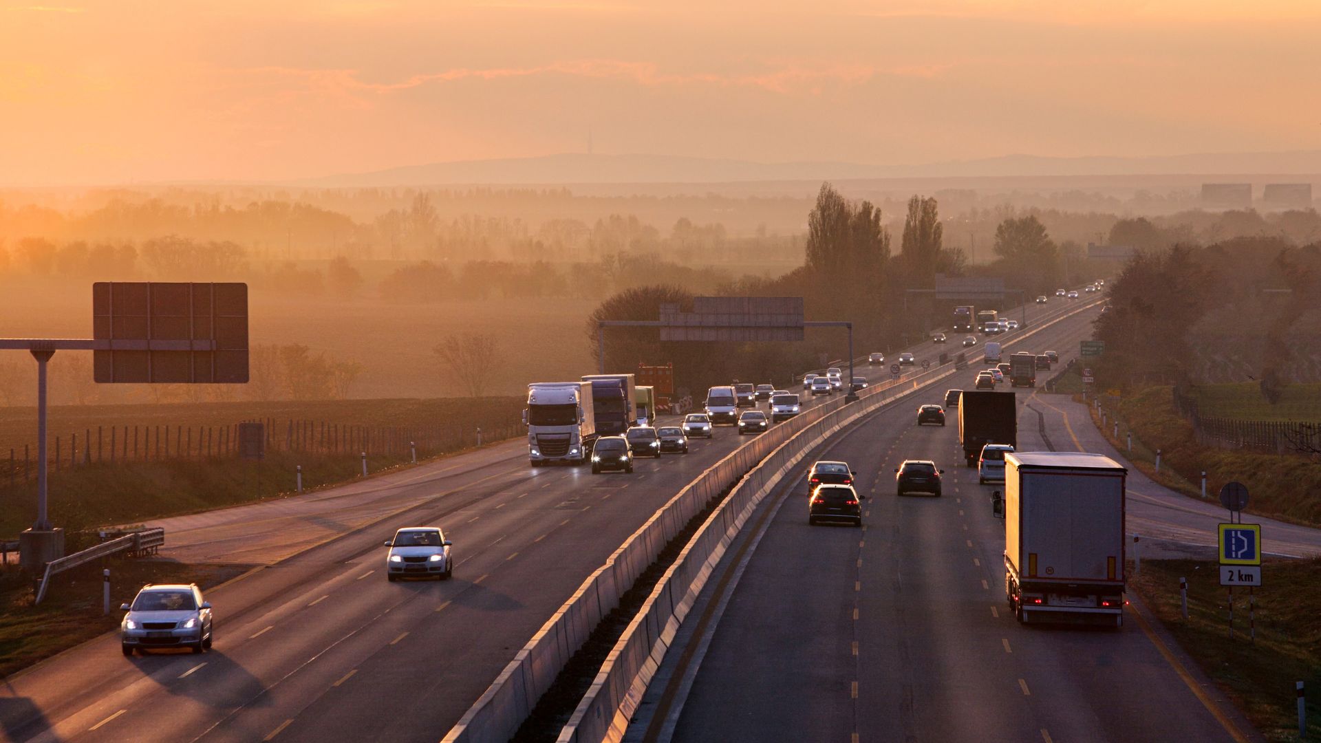 Cars and trucks driving on a highway