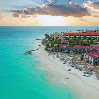 A resort in Aruba on the beach and simply stunning blue ocean waters