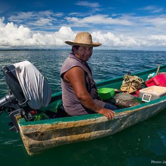Belizean fisherman Yonardo Cus on fishing boat