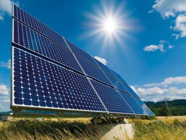 Solar panels and sun shining from above