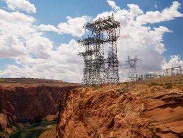 Electrical towers on rocky outcroppings.