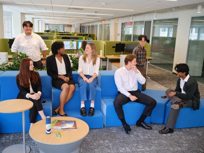 EDF interns talking in the office.